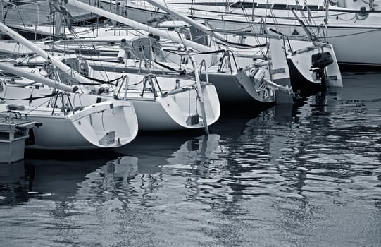 Tall luxury boats and yachts moored in duquesa Port In Spain