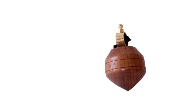 An image of a wooden antique child's toy top 