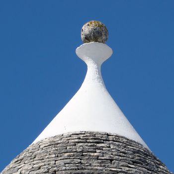 pinacle of trullo, typical building in Puglia in Italy