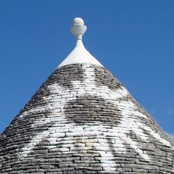 painted magical symbol on roof of trullo house in Alberobello,Puglia, Italy.