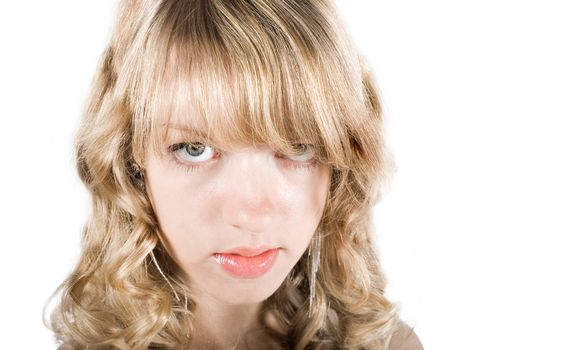 Funny close-up face of a young blond girl