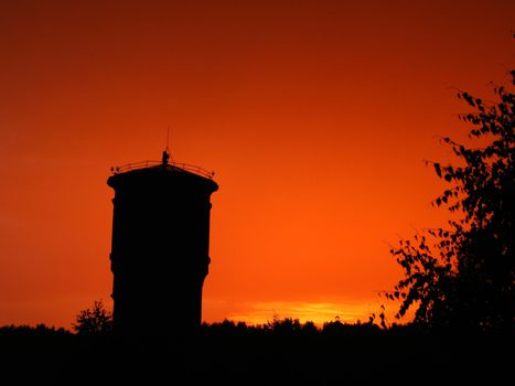fantastic red sky, silhouette tower, sunset , clear sky