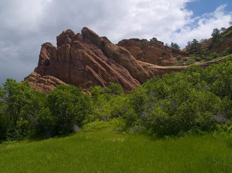 Spring at a red rock cliff in Roxborough State Park, Colorado