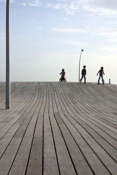 Tel Aviv deck in the old port with children