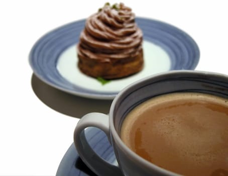 Still life with a cup of coffee and a cake.Selective focus on the coffee cup.Isolation over white background with clipping path included in the file.          