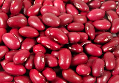 Heaps of red beans wth light reflections          