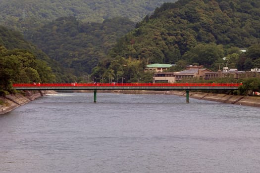  Traditional Japanese red bridge over Uji river.         