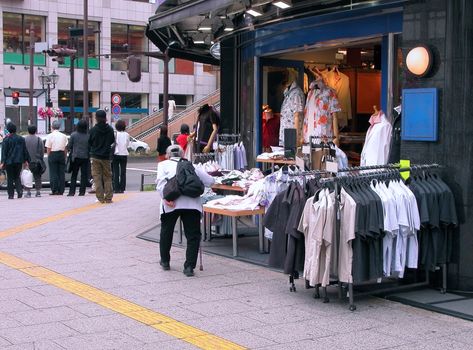 City aspect in front of a clothes shop.          