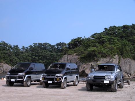Three jeeps in an outdoor area-Matsushima Bay,Japan.          