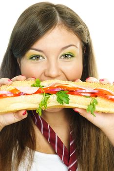 beautiful young woman eating a hamburger isolated against white background