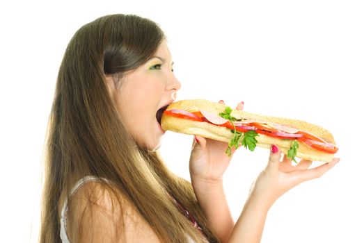 beautiful young woman eating a big hamburger isolated against white background