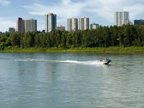 Power boating on the North Saskatewan River in Edmonton, Alberta, Canada is a popular activity in the summertime.