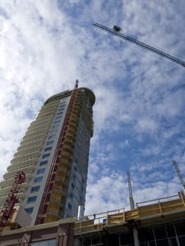 Crane towering over the city street on a condo construction site.