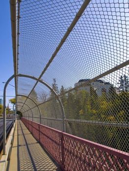 Chainlink fence protecting pedestrians from falling.