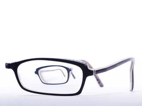 broken eyeglasses one half to be seen throug glass of the other half