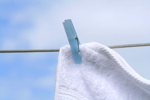 Wash day/Fluffy towel hanging with clothespin on the line