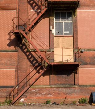 Rusty Old Fire Escape Stairs on Warehouse