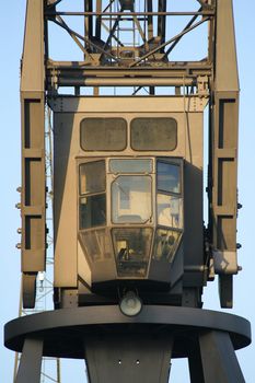 Close-up of empty crane driver cabin after work. Cargo crane in Hamburg harbour, Germany.
