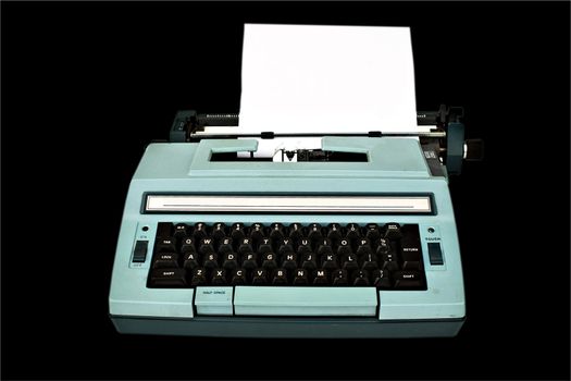 Old typewriter with paper isolated with clipping path over black background