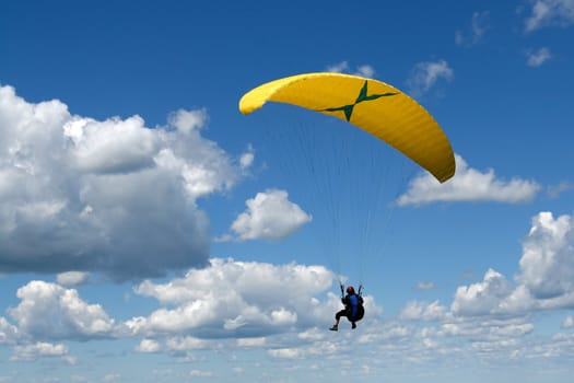 Paragliding in a deep blue sky