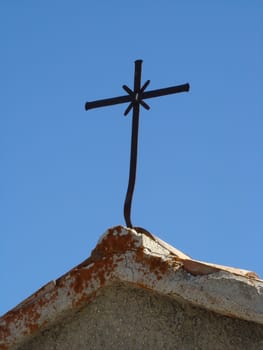 cross on the chapel in Sibillini mountains in Italy