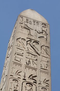 Top of the obelisk in front of the entrance of Luxor Temple in Egypt. 