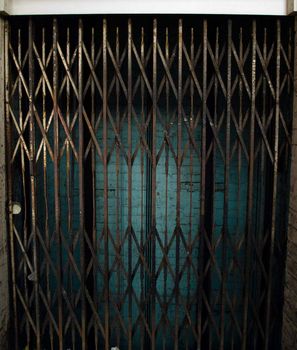 Rusty Elevator Gates and Dark Lift Shaft