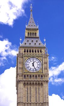 Big Ben with fluffy white clouds and blue sky