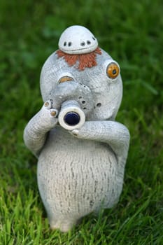 The image of a clay toy on a grass