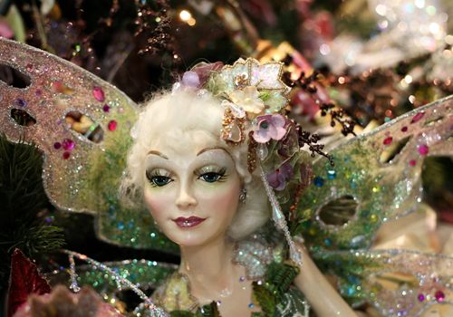 The doll - fairy with wings on a New Year tree