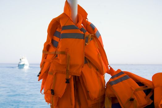 The red life jackets on boat