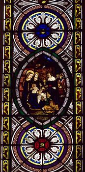 stained glass church window with nativity scene