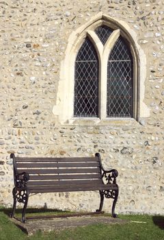 old fashioned bench before a church