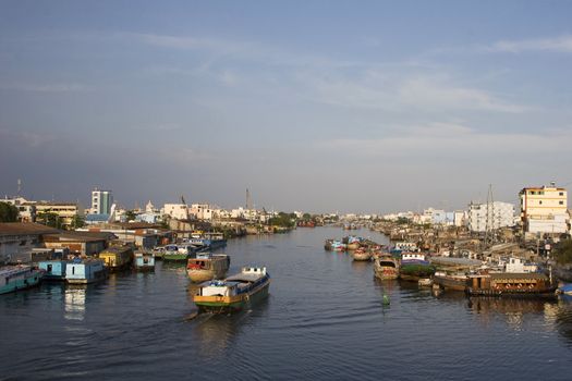 Busy city life by the Mekong river outside Ho Chi Minh city (Saigon), Vietnam. 