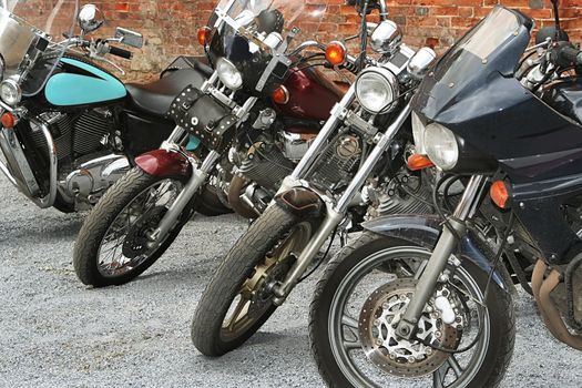 Four sports and modern motorcycles on parking