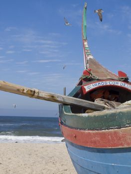 Fisherman boat waiting to go to the sea. We can read "We go with Good"