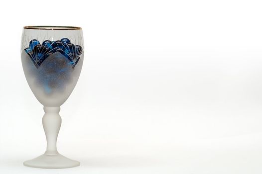 Tall wine glass with blue transparent spheres