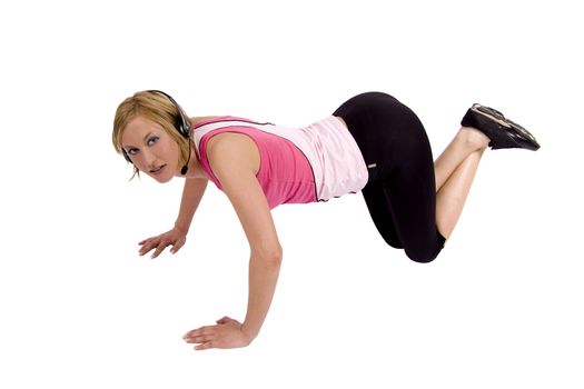 A blond Swedish fitness model is doing push-ups