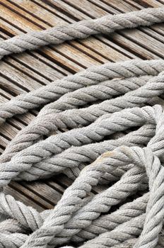 Close-up of hank of rope on a wooden jetty