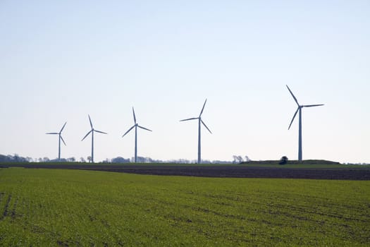 5 modern wind mills from Scandinavia, Sweden on a green field