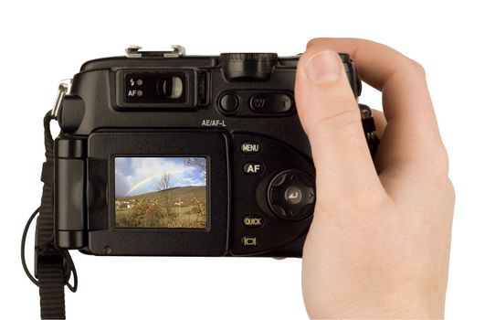 Digital Camera photo in a hand isolated on withe background. lcd screen and background can be easily edited