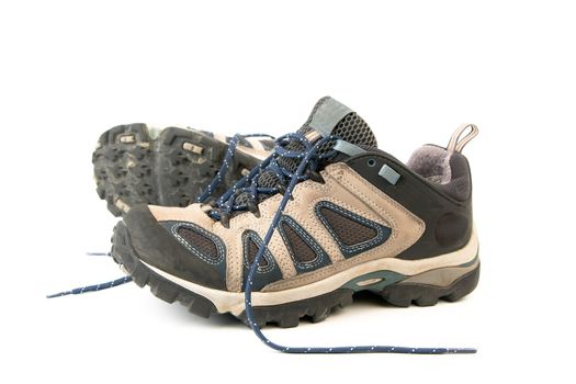 clothes hiking boots or shoes isolated on a withe background made of leather and waterproof and breathable membrane