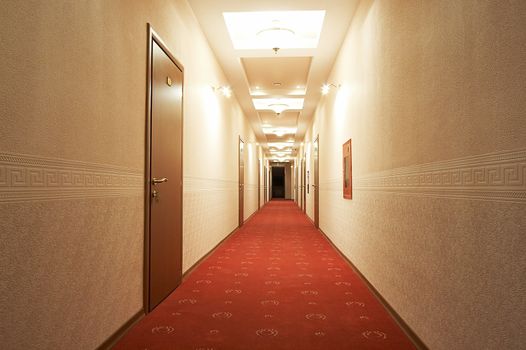 Beautiful and long corridor in modern hotel