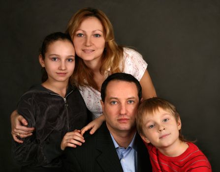 Portrait of parents and children in studio