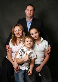 Portrait of parents and children in studio