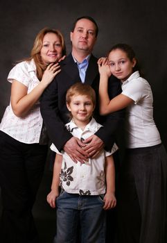 Portrait of parents and children in studio