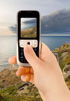 a technology cellular phone holding in a human hand