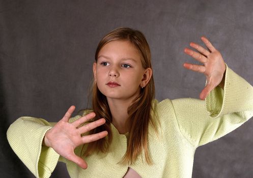 The beautiful girl in a yellow sweater