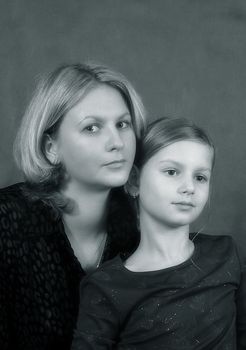 Portrait of mum and the daughter in studio