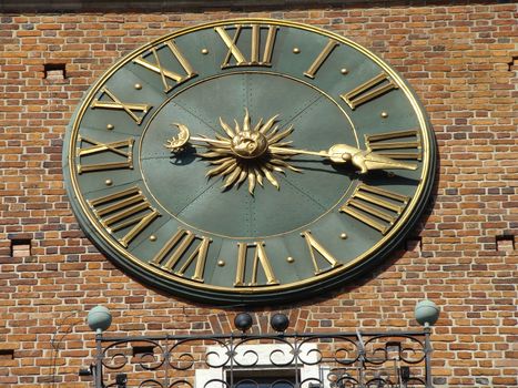 clock on the tower of town hall in Cracow, Poland